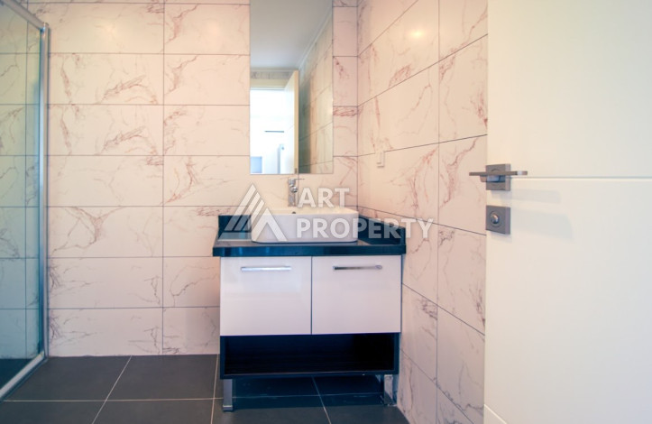 Меблированные апартаменты планировки 1+1 в районе Махмутлар, 75м2 - Ракурс 12