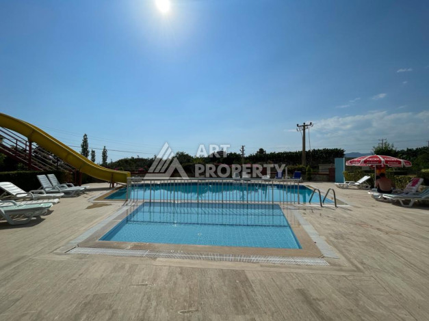 Апартаменты с просторной террасой и видом на море планировки 3+1 в районе Махмутлар, 185м2 - Ракурс 2