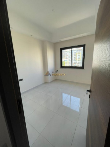 Двухкомнатная квартира в комплексе с инфраструктурой уровня 5-ти звездочного отеля в Махмутлар, 50м2 - Ракурс 5