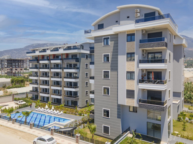 Квартира 1+1 в жилом комплексе вблизи Средиземного моря в районе Каргыджак, 51 м2 - Ракурс 2