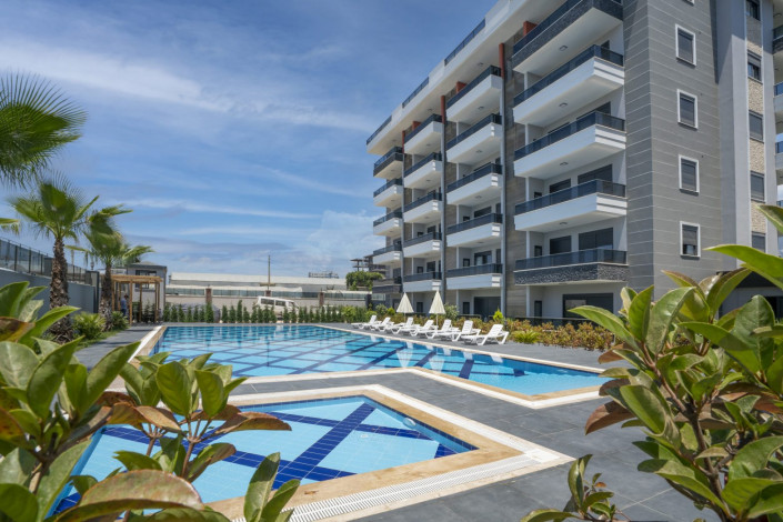 Квартира 1+1 в жилом комплексе вблизи Средиземного моря в районе Каргыджак, 51 м2 - Ракурс 6