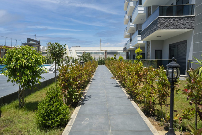 Квартира 1+1 в жилом комплексе вблизи Средиземного моря в районе Каргыджак, 51 м2 - Ракурс 7