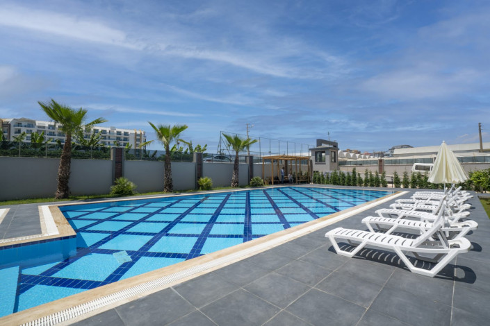 Квартира 1+1 в жилом комплексе вблизи Средиземного моря в районе Каргыджак, 51 м2 - Ракурс 8