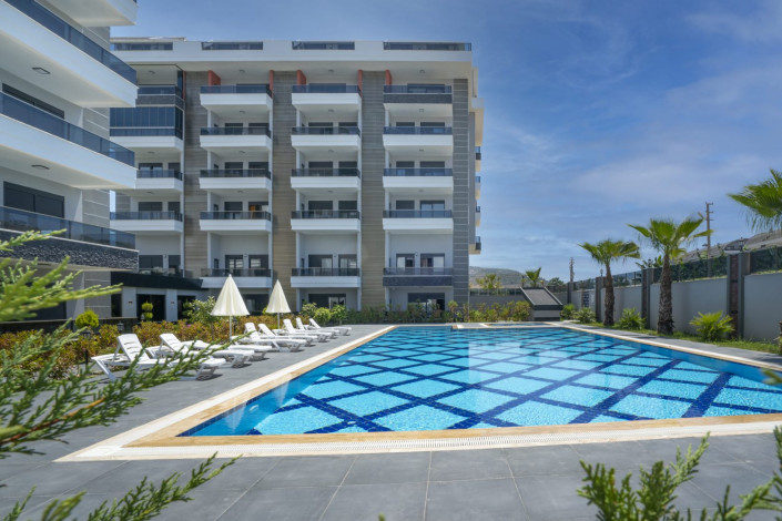 Квартира 1+1 в жилом комплексе вблизи Средиземного моря в районе Каргыджак, 51 м2 - Ракурс 9