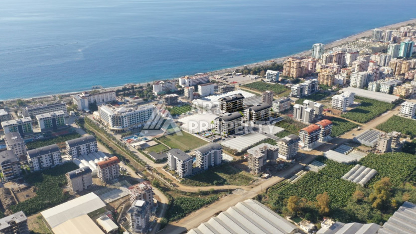 Новый инвестиционный проект в 200 метрах от моря в районе Каргыджак! - Ракурс 12