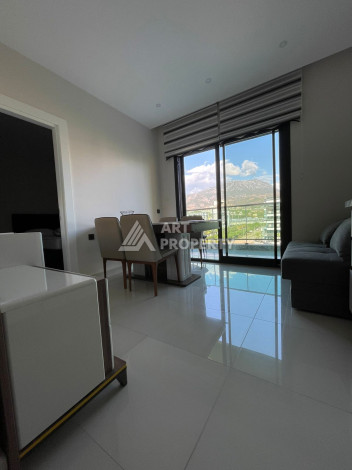 Апартаменты в 50 метрах от моря в шикарном жилом комплексе в районе Каргыджак. Планировка 1+1, 50м2 - Ракурс 2