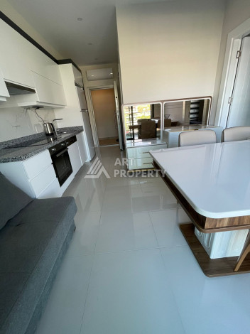 Апартаменты в 50 метрах от моря в шикарном жилом комплексе в районе Каргыджак. Планировка 1+1, 50м2 - Ракурс 3