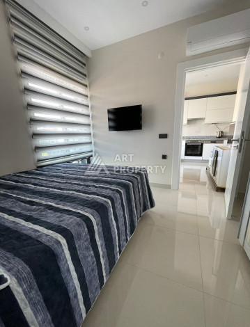 Апартаменты в 50 метрах от моря в шикарном жилом комплексе в районе Каргыджак. Планировка 1+1, 50м2 - Ракурс 9