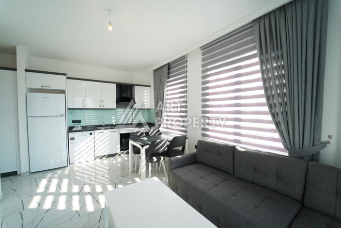 Апартаменты с новой мебелью в 50-ти метрах от моря планировки 1+1, 60м2 - Ракурс 2