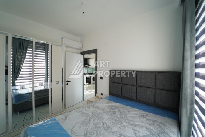 Апартаменты с новой мебелью в 50-ти метрах от моря планировки 1+1, 60м2 - Ракурс 5