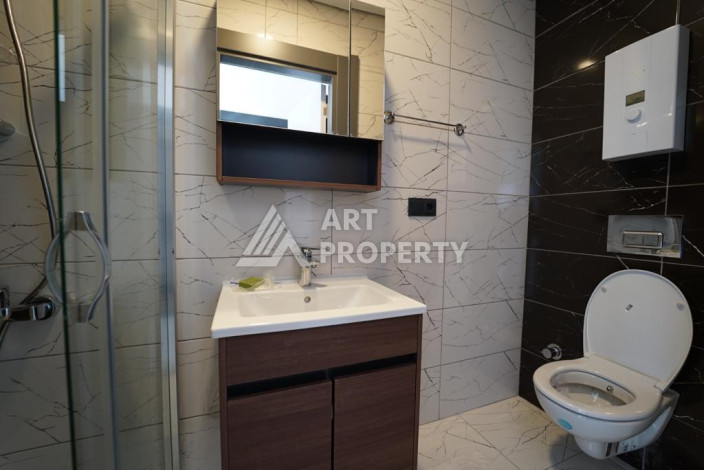 Апартаменты с новой мебелью в 50-ти метрах от моря планировки 1+1, 60м2 - Ракурс 7