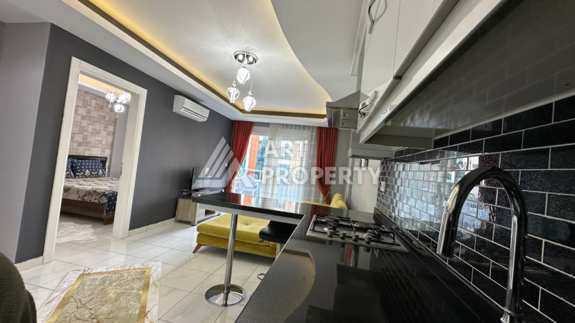 Квартира в Махмутларе 1+1 с мебелью - Ракурс 9