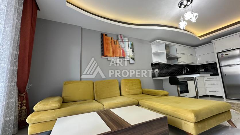 Квартира в Махмутларе 1+1 с мебелью - Ракурс 13