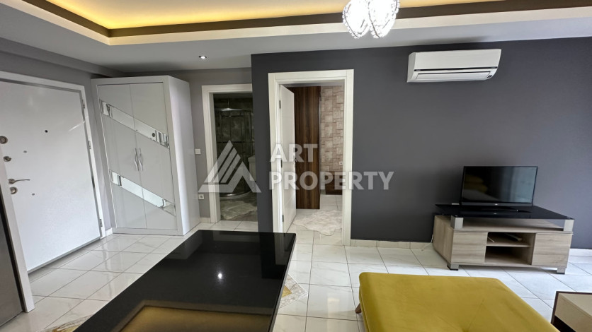 Квартира в Махмутларе 1+1 с мебелью - Ракурс 14