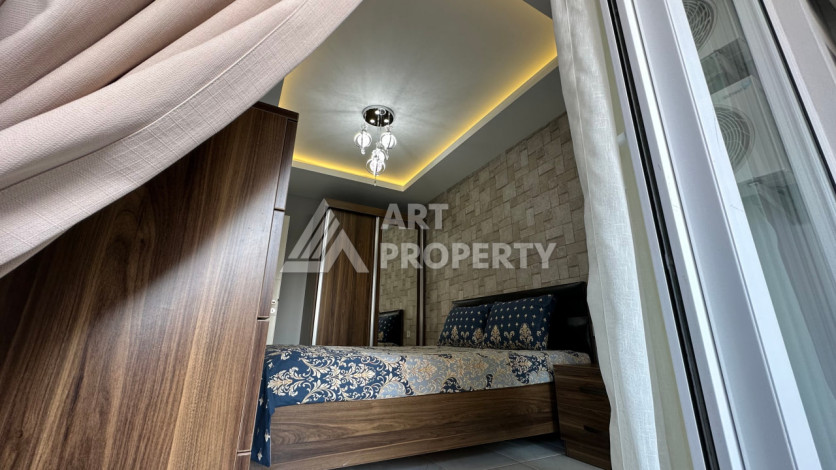 Квартира в Махмутларе 1+1 с мебелью - Ракурс 23