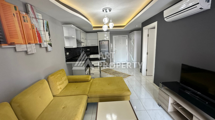 Квартира в Махмутларе 1+1 с мебелью - Ракурс 30