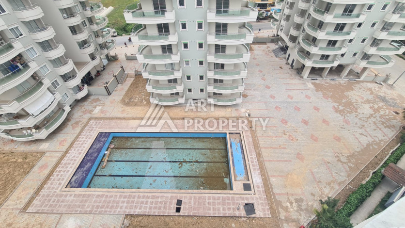 Просторная 125м2 квартира 2+1 в благоустроенном районе махмутлара Махмутларе - Ракурс 2