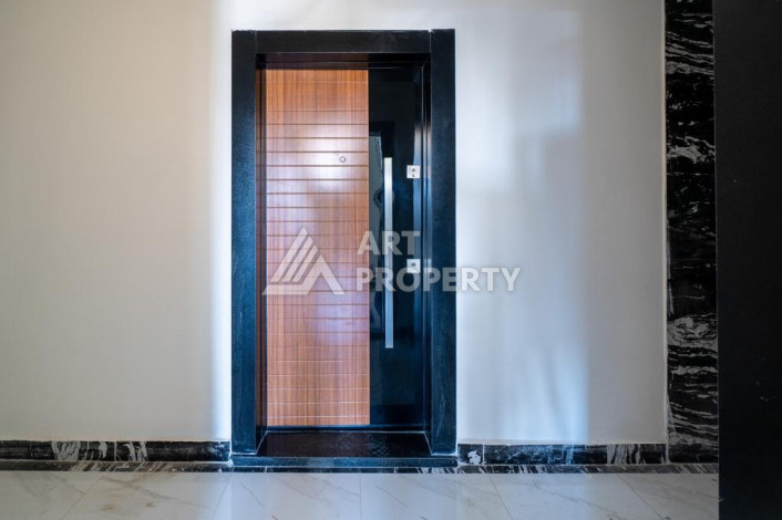 Квартира 1+1 с панорамным видом на море в новом доме в центральной части Алании - Ракурс 2