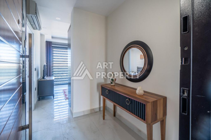 Квартира 1+1 с панорамным видом на море в новом доме в центральной части Алании - Ракурс 3