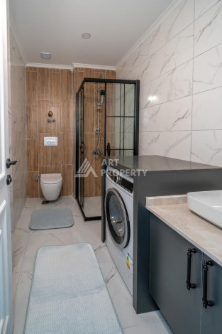 Квартира 1+1 с панорамным видом на море в новом доме в центральной части Алании - Ракурс 4