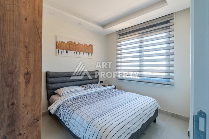 Квартира 1+1 с панорамным видом на море в новом доме в центральной части Алании - Ракурс 5