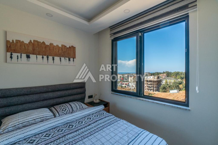 Квартира 1+1 с панорамным видом на море в новом доме в центральной части Алании - Ракурс 7