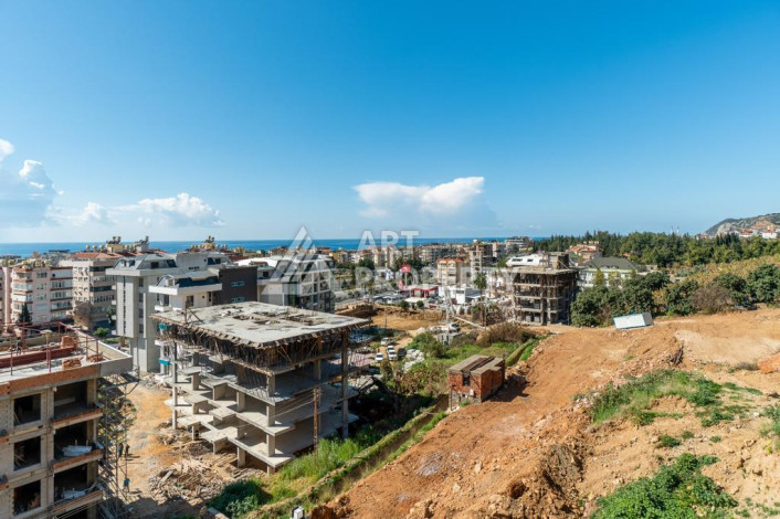 Квартира 1+1 с панорамным видом на море в новом доме в центральной части Алании - Ракурс 9