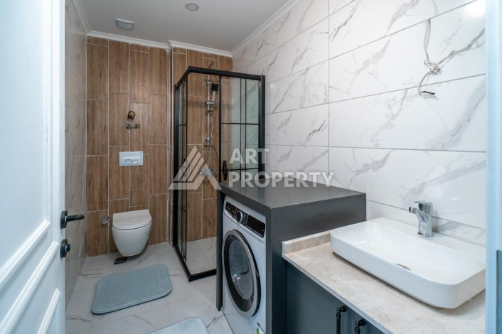 Квартира 1+1 с панорамным видом на море в новом доме в центральной части Алании - Ракурс 11