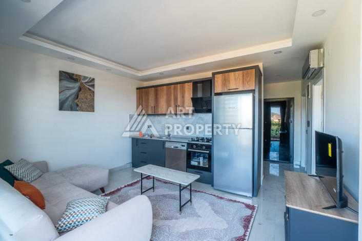 Квартира 1+1 с панорамным видом на море в новом доме в центральной части Алании - Ракурс 12