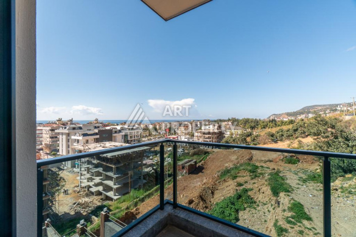 Квартира 1+1 с панорамным видом на море в новом доме в центральной части Алании - Ракурс 13