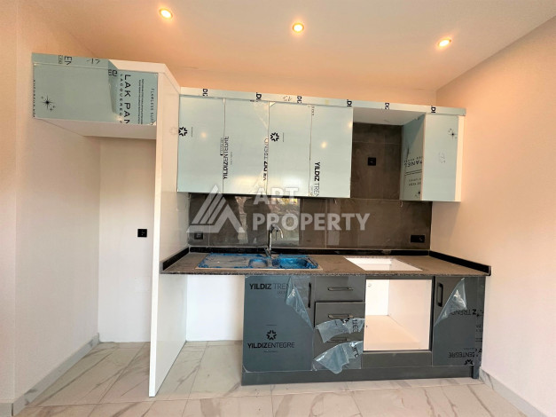 Новая квартира 1+1 с видом на горы и бассейн в районе Оба! - Ракурс 7