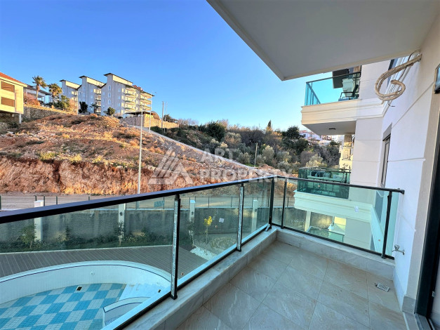 Новая квартира 1+1 с видом на горы и бассейн в районе Оба! - Ракурс 9