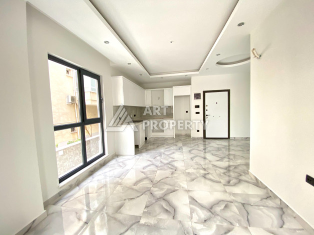 Квартира 1+1 в новостройке в самом центре Алании в 150 м от пляжа! - Ракурс 11