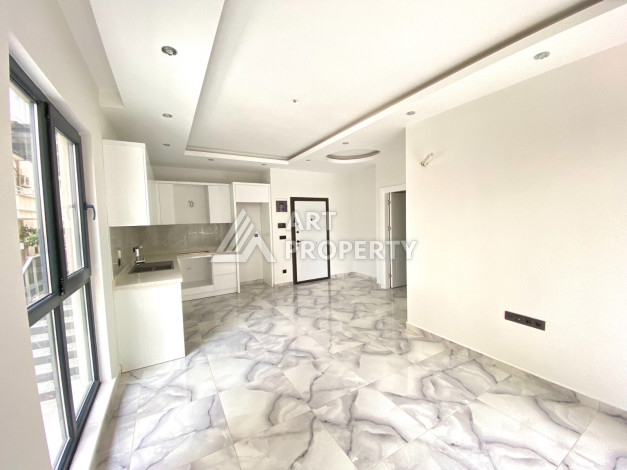 Квартира 1+1 в новостройке в самом центре Алании в 150 м от пляжа! - Ракурс 12