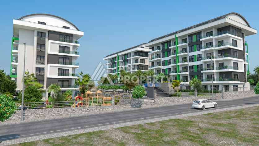 Комплекс на этапе строительства от ведущего застройщика Алании в районе Каргыджак! - Ракурс 2