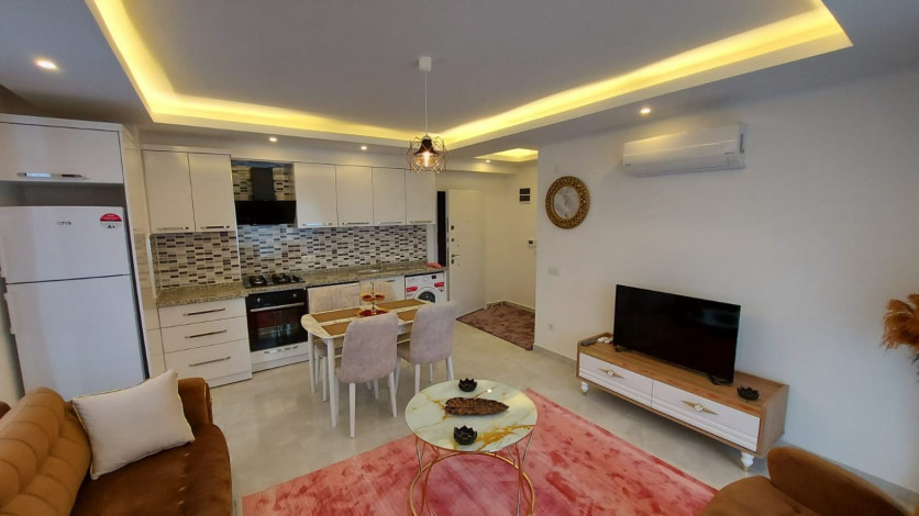 Меблированные апартаменты  планировки 1+1 в 150 метрах от Средиземного моря в районе Кестель, Алания,65 м2 - Ракурс 7